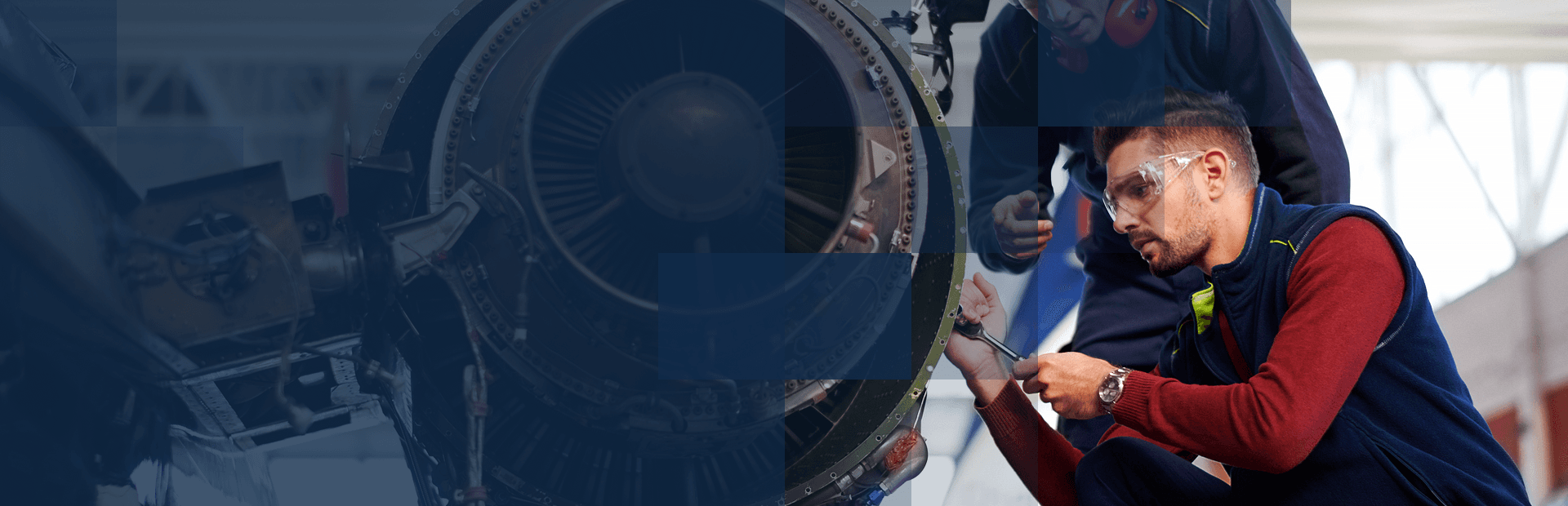 A man repairing an airplane engine