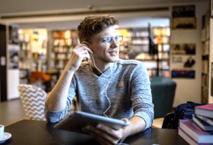 Man learning in a cafe